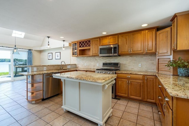 27 Wentworth Ter, Dover, NH 03820 - kitchen featuring appliances with stainless steel finishes, open shelves, a peninsula, brown cabinetry, and decorative backsplash