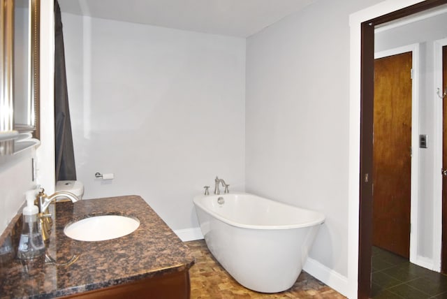 49 Bowker St, Claremont, NH 03743 - bathroom featuring a freestanding tub and vanity