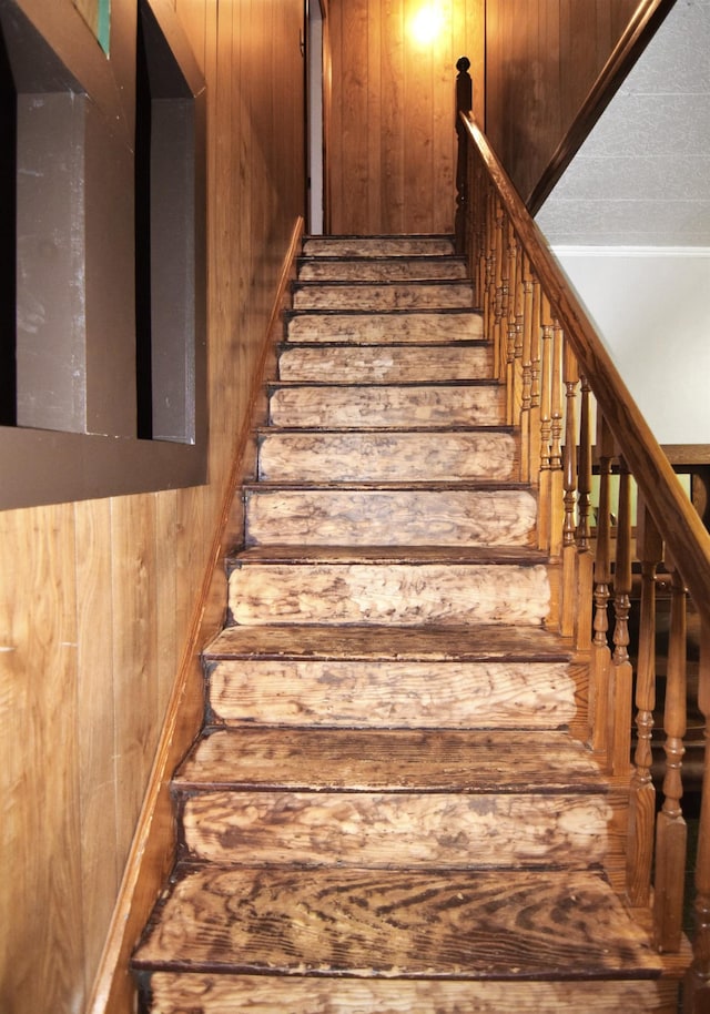 49 Bowker St, Claremont, NH 03743 - staircase with wooden walls