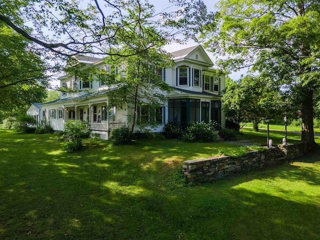 50 Lane Ridge Rd, Claremont, NH 03743 - view of front of house with a front yard, covered porch, and a sunroom