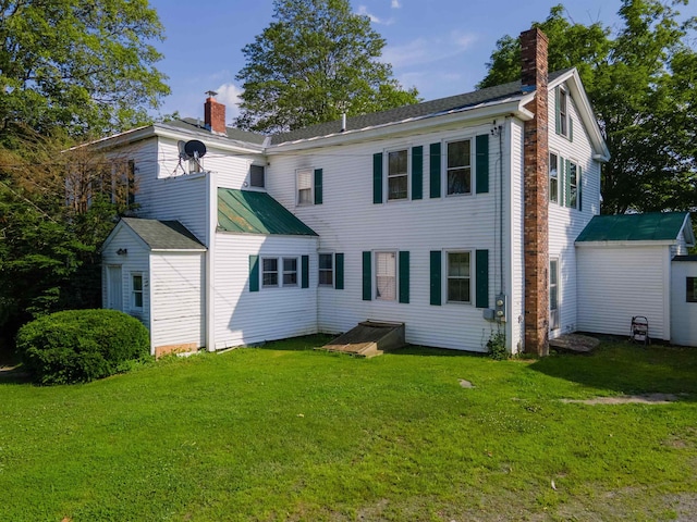 50 Lane Ridge Rd, Claremont, NH 03743 - rear view of property featuring a chimney and a yard