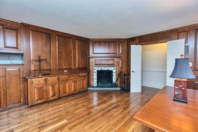 16 Storybrook Ln, Amherst, NH 03031 - unfurnished living room with light wood finished floors and a tiled fireplace