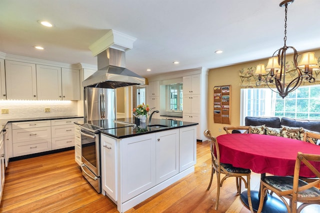 16 Storybrook Ln, Amherst, NH 03031 - kitchen with stainless steel appliances, island exhaust hood, a chandelier, white cabinetry, and dark countertops