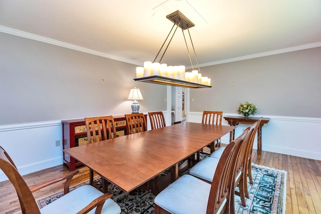 16 Storybrook Ln, Amherst, NH 03031 - dining area with ornamental molding, hardwood / wood-style flooring, and a chandelier