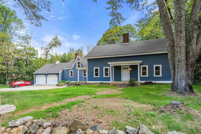 71 Plummer Hill Rd, Belmont, NH 03220 - view of front of home with a chimney, a garage, a front lawn, driveway, and a porch