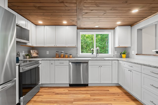 71 Plummer Hill Rd, Belmont, NH 03220 - kitchen featuring stainless steel appliances, wood ceiling, white cabinets, light wood-style floors, and light stone countertops