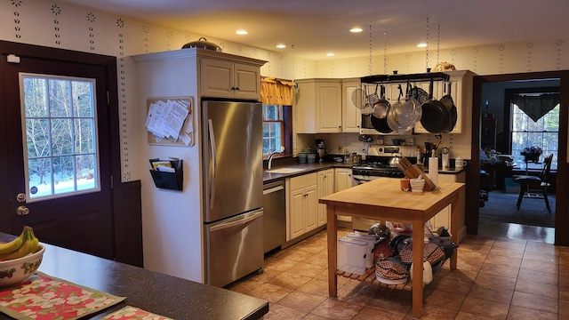 987 Dunbar Hill Rd, Grantham, NH 03753 - kitchen with stainless steel appliances, wallpapered walls, butcher block counters, plenty of natural light, and recessed lighting