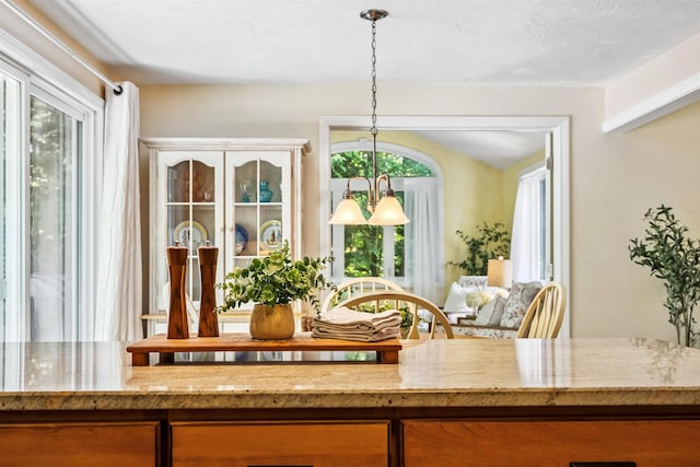 5 Cowin Rd, Merrimack, NH 03054 - detailed view of light stone countertops and brown cabinetry