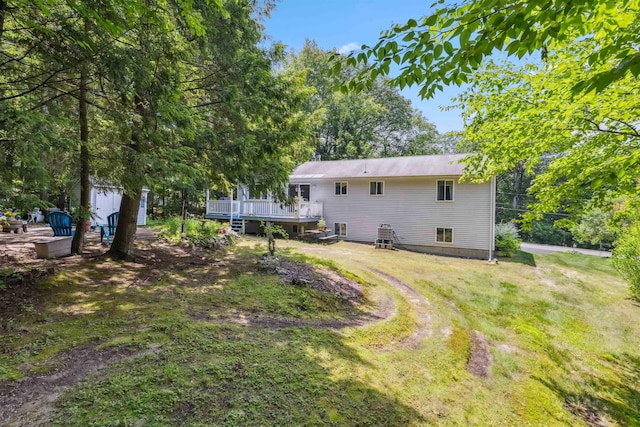 5 Cowin Rd, Merrimack, NH 03054 - rear view of house with a wooden deck and a lawn