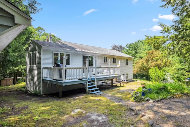 5 Cowin Rd, Merrimack, NH 03054 - back of property featuring a deck and a chimney