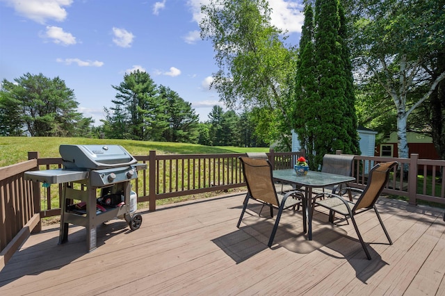 14 Anagance Ln, Wolfeboro, NH 03894 - wooden terrace featuring outdoor dining space, grilling area, and a lawn