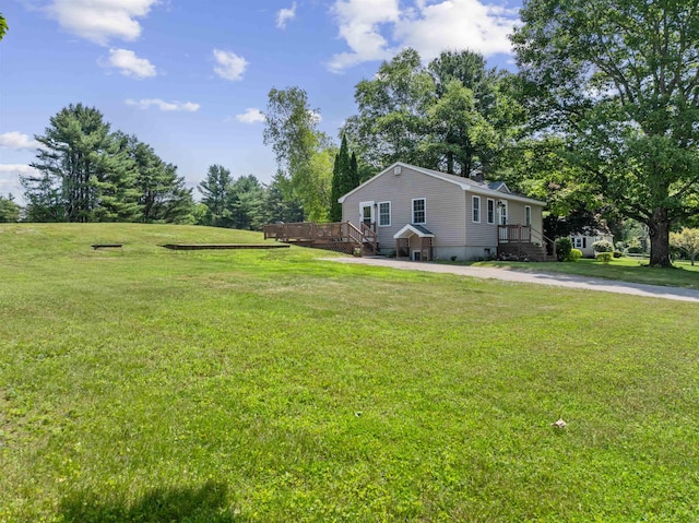 14 Anagance Ln, Wolfeboro, NH 03894 - view of grassy yard featuring a deck