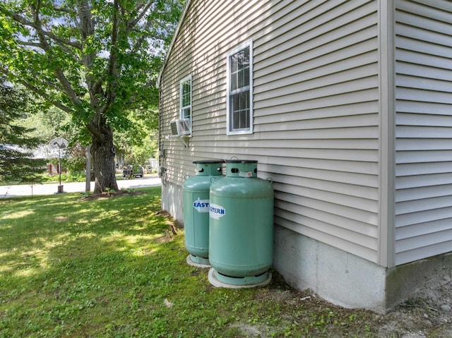 14 Anagance Ln, Wolfeboro, NH 03894 - view of side of home with a lawn and cooling unit
