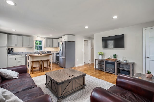 14 Anagance Ln, Wolfeboro, NH 03894 - living room featuring light wood finished floors and recessed lighting