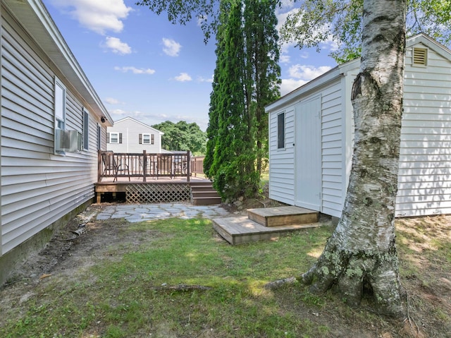14 Anagance Ln, Wolfeboro, NH 03894 - view of grassy yard with a deck and cooling unit
