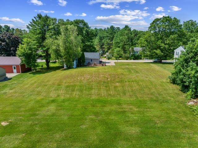 14 Anagance Ln, Wolfeboro, NH 03894 - view of green lawn featuring an outbuilding