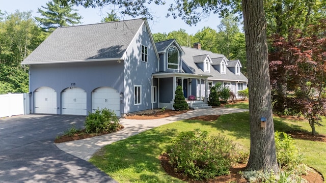 123 Stephen Dr, Goffstown, NH 03045 - cape cod-style house with driveway, roof with shingles, a chimney, and a garage