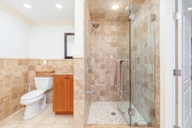 123 Stephen Dr, Goffstown, NH 03045 - bathroom with tile walls, ornamental molding, a stall shower, vanity, and tile patterned floors