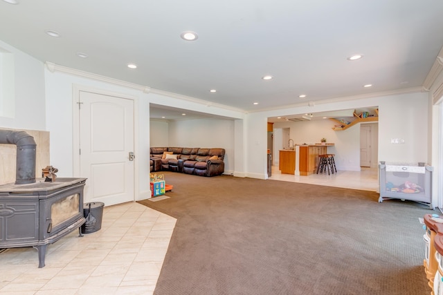 123 Stephen Dr, Goffstown, NH 03045 - living area featuring crown molding, light colored carpet, recessed lighting, and a wood stove