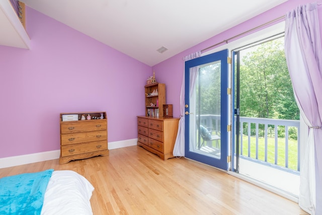 123 Stephen Dr, Goffstown, NH 03045 - bedroom with wood finished floors, access to outside, and vaulted ceiling