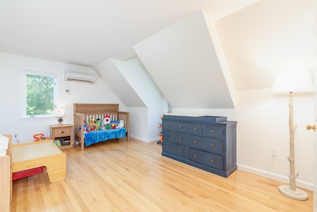 123 Stephen Dr, Goffstown, NH 03045 - bedroom with a wall mounted air conditioner, light wood-style flooring, and lofted ceiling