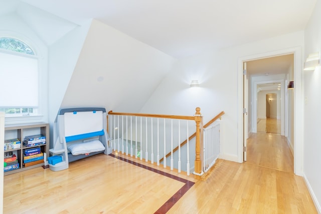 123 Stephen Dr, Goffstown, NH 03045 - hallway featuring an upstairs landing, lofted ceiling, wood finished floors, and healthy amount of natural light