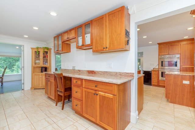 123 Stephen Dr, Goffstown, NH 03045 - kitchen featuring stainless steel double oven, recessed lighting, built in desk, glass insert cabinets, and crown molding