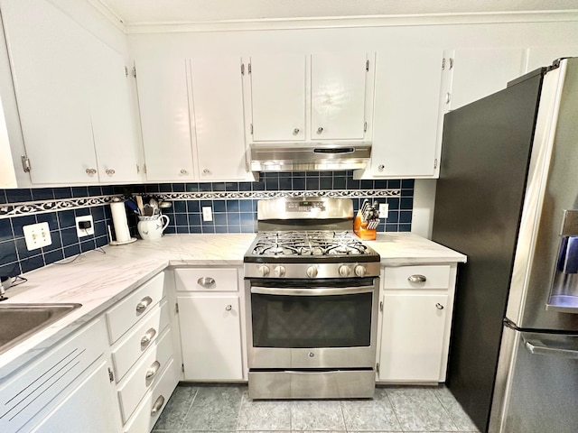 22 Mason Rd, Merrimack, NH 03054 - kitchen with stainless steel appliances, under cabinet range hood, white cabinets, and tasteful backsplash