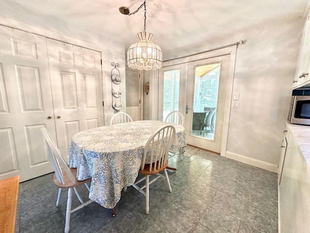 22 Mason Rd, Merrimack, NH 03054 - dining area with a chandelier and baseboards