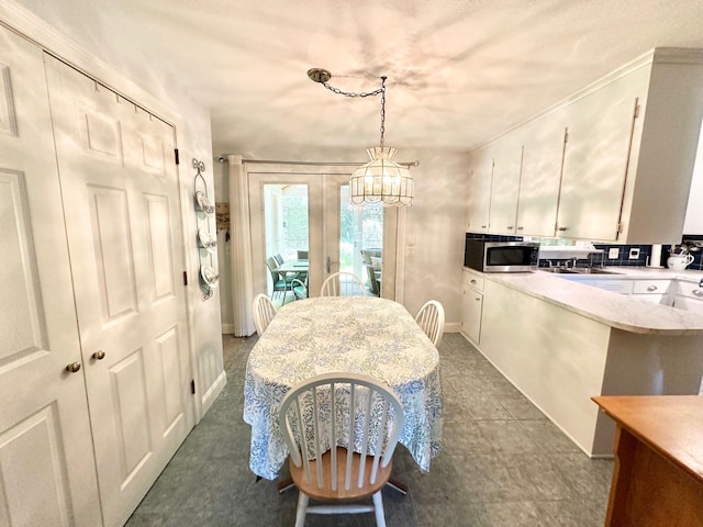 22 Mason Rd, Merrimack, NH 03054 - dining space with a chandelier