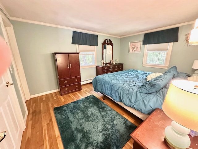 22 Mason Rd, Merrimack, NH 03054 - bedroom featuring baseboard heating, wood finished floors, and crown molding