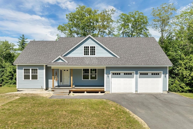 53 Richards Way, Farmington, NH 03835 - view of front facade featuring an attached garage, asphalt driveway, a front lawn, a shingled roof, and a porch
