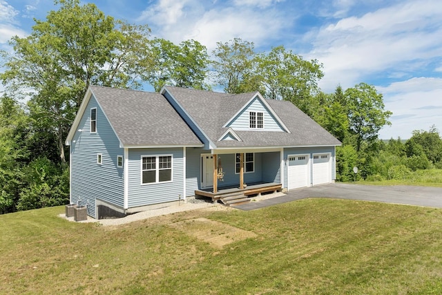 53 Richards Way, Farmington, NH 03835 - view of front of home with a porch, an attached garage, asphalt driveway, a shingled roof, and a front yard
