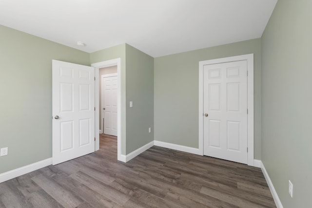 53 Richards Way, Farmington, NH 03835 - unfurnished bedroom featuring dark wood-type flooring