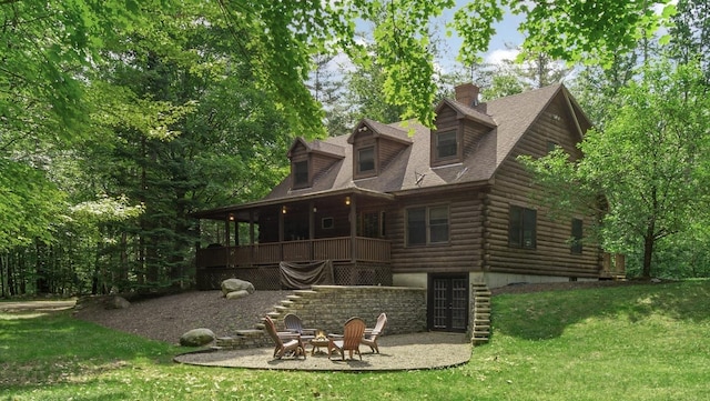 104 Rolling Ridge Rd, Bartlett, NH 03812 - back of property featuring a yard, an outdoor fire pit, log siding, and a chimney