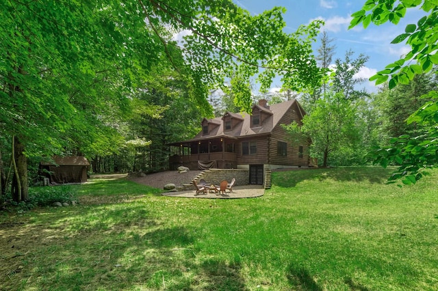 104 Rolling Ridge Rd, Bartlett, NH 03812 - view of green lawn featuring a patio area and stairway