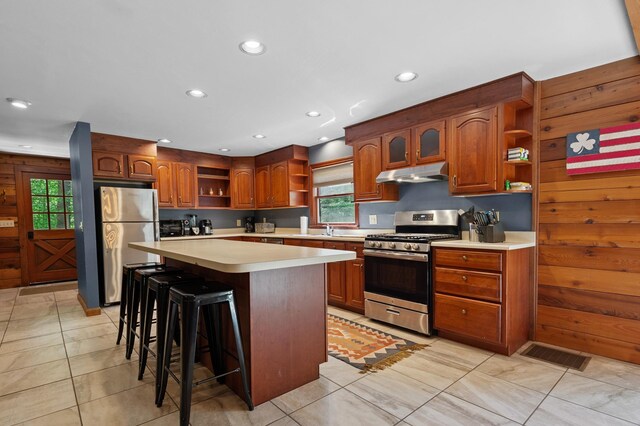104 Rolling Ridge Rd, Bartlett, NH 03812 - kitchen with open shelves, stainless steel appliances, under cabinet range hood, light countertops, and plenty of natural light
