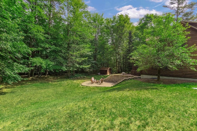 104 Rolling Ridge Rd, Bartlett, NH 03812 - view of green lawn with a storage unit