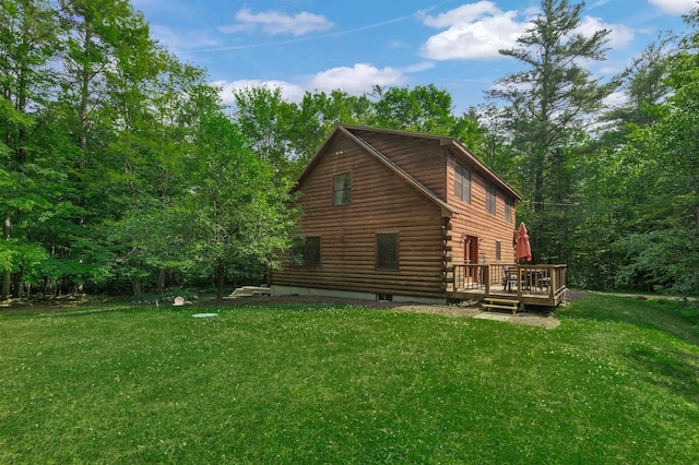 104 Rolling Ridge Rd, Bartlett, NH 03812 - view of home's exterior with a wooden deck, a lawn, and log siding