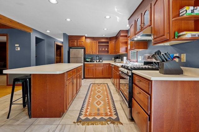 104 Rolling Ridge Rd, Bartlett, NH 03812 - kitchen with open shelves, appliances with stainless steel finishes, under cabinet range hood, recessed lighting, and a center island