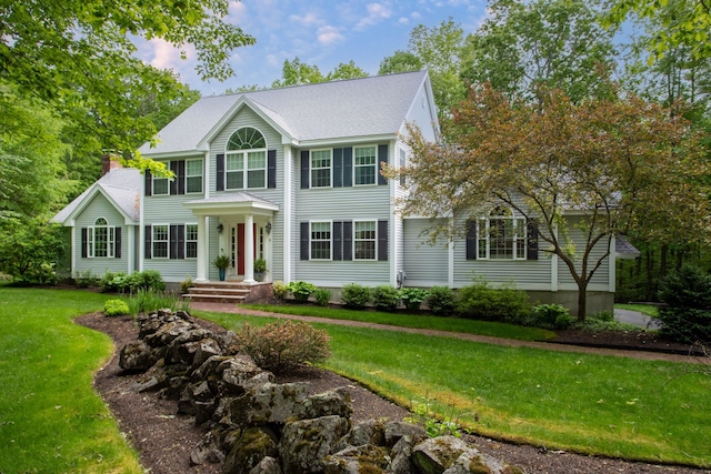 9 Deerhaven Dr, Exeter, NH 03833 - colonial home featuring a front lawn and a chimney