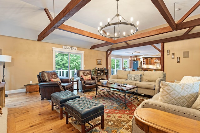 9 Deerhaven Dr, Exeter, NH 03833 - living area with a chandelier, beamed ceiling, and light wood-type flooring
