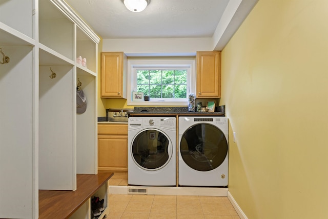 9 Deerhaven Dr, Exeter, NH 03833 - laundry area with washer and dryer, cabinet space, and light tile patterned floors
