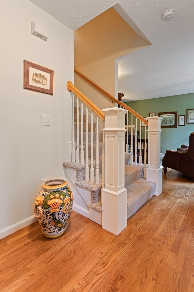 9 Deerhaven Dr, Exeter, NH 03833 - stairs featuring wood finished floors and baseboards