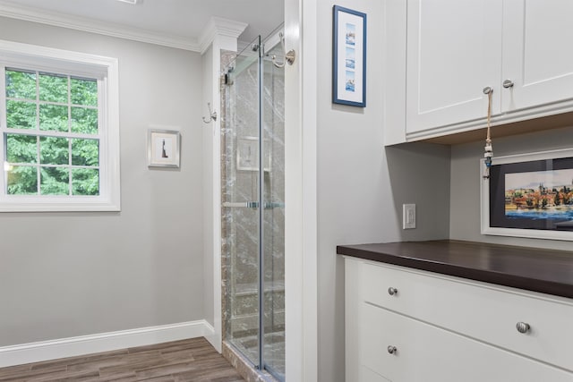 9 Deerhaven Dr, Exeter, NH 03833 - full bathroom with ornamental molding, a stall shower, and wood finished floors