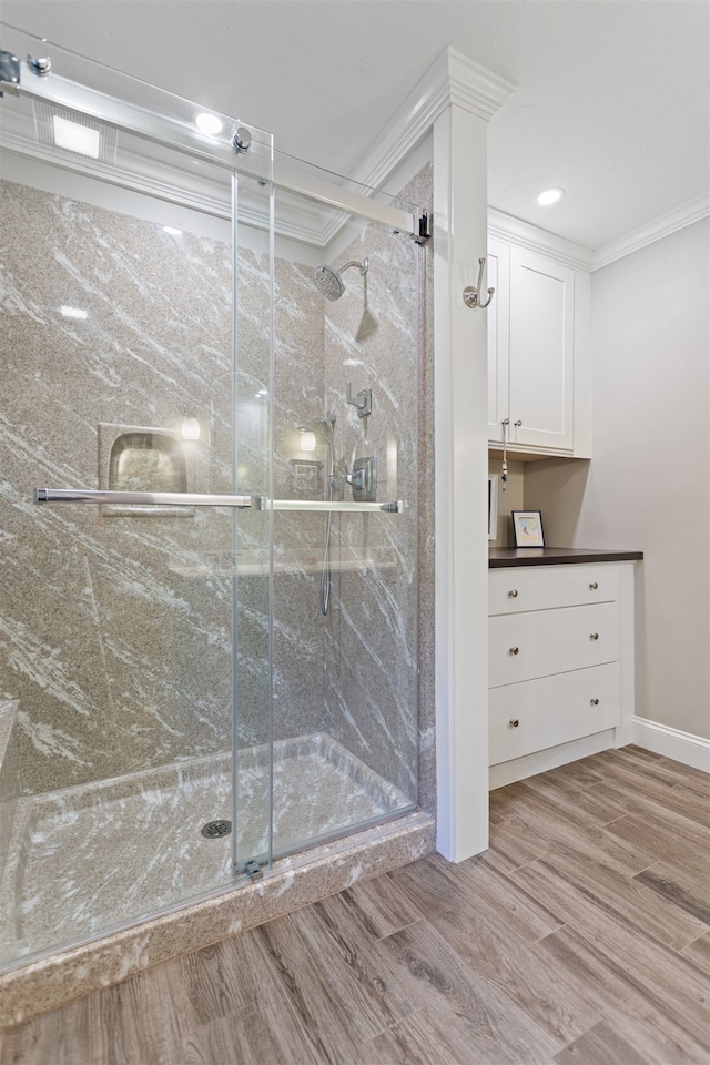 9 Deerhaven Dr, Exeter, NH 03833 - bathroom featuring ornamental molding, a shower stall, and wood finished floors