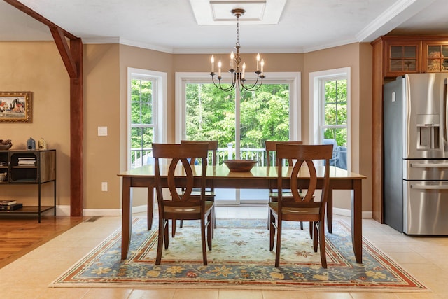 9 Deerhaven Dr, Exeter, NH 03833 - dining area with a chandelier, light tile patterned flooring, and crown molding