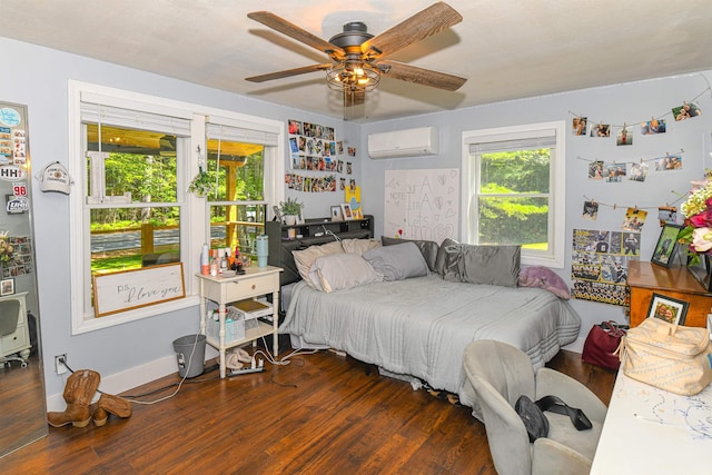 2129 E Conway Rd, Conway, NH 03813 - bedroom featuring a wall mounted AC, wood finished floors, and ceiling fan