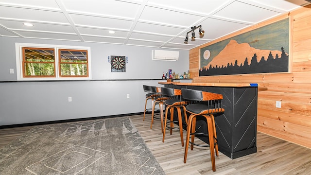 2129 E Conway Rd, Conway, NH 03813 - indoor dry bar with wood finished floors, a wall mounted AC, recessed lighting, and wooden walls