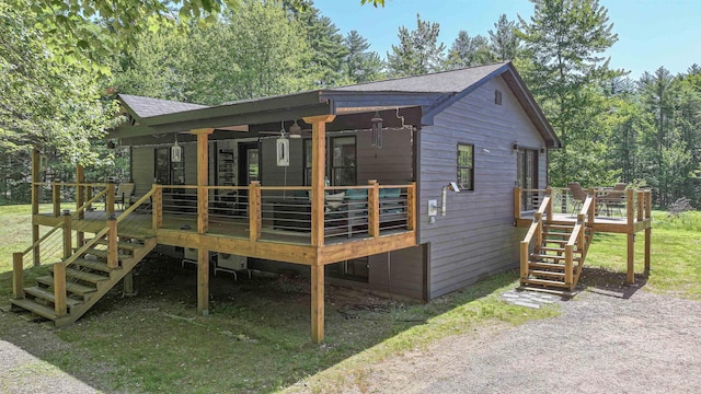 2129 E Conway Rd, Conway, NH 03813 - view of front of home with stairs, a wooden deck, and roof with shingles